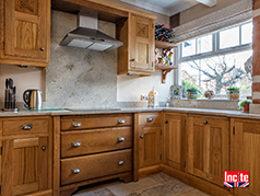 Oak Fitted Kitchen with added hand carved features.