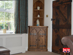 Plank Pine Gothic Themed Corner cabinet with Arched Doors and open shelves 